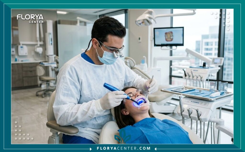 طبيب أسنان متخصص يستخدم أحدث التقنيات الطبية لتطبيق حشوة الاسنان الامامية التجميلية في عيادة حديثة.
